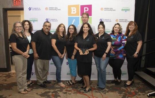 MFA Staff showcasing award after ranking in top 5 of the 2023 Best Places to work.