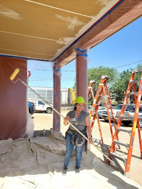 MFA Asset Management Department File Analyst Nayeli Cano assisted with painting the patio of one of the homes.