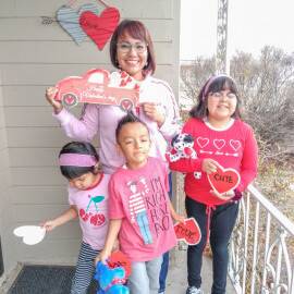 Cheryle with her 3 children at her new home.