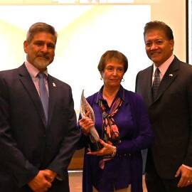 Tierra del Sol Housing Corporation Executive Director Rose Garcia accepts an award at the November MFA Board meeting.